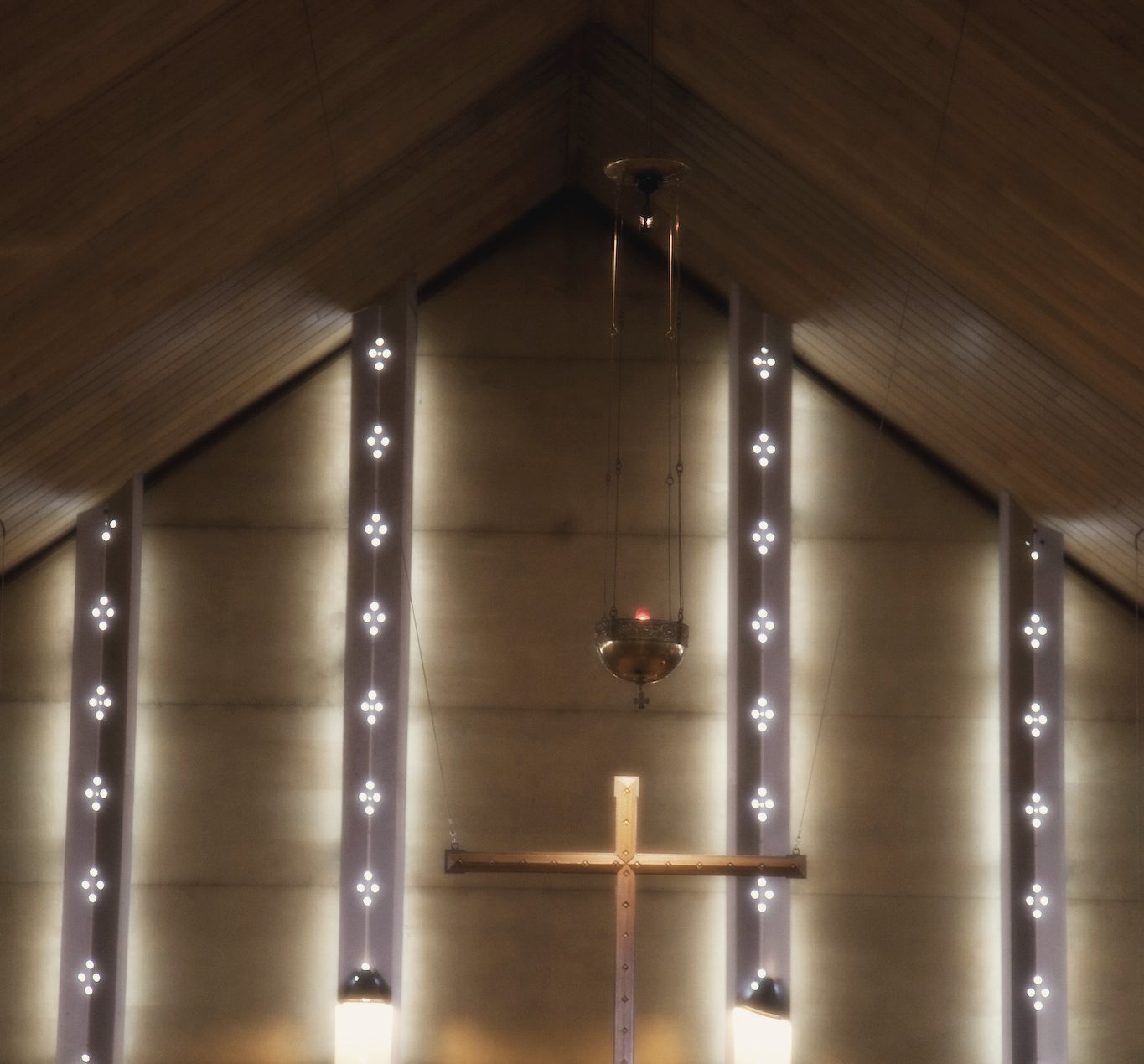 Light falling across a timber chapel wall
