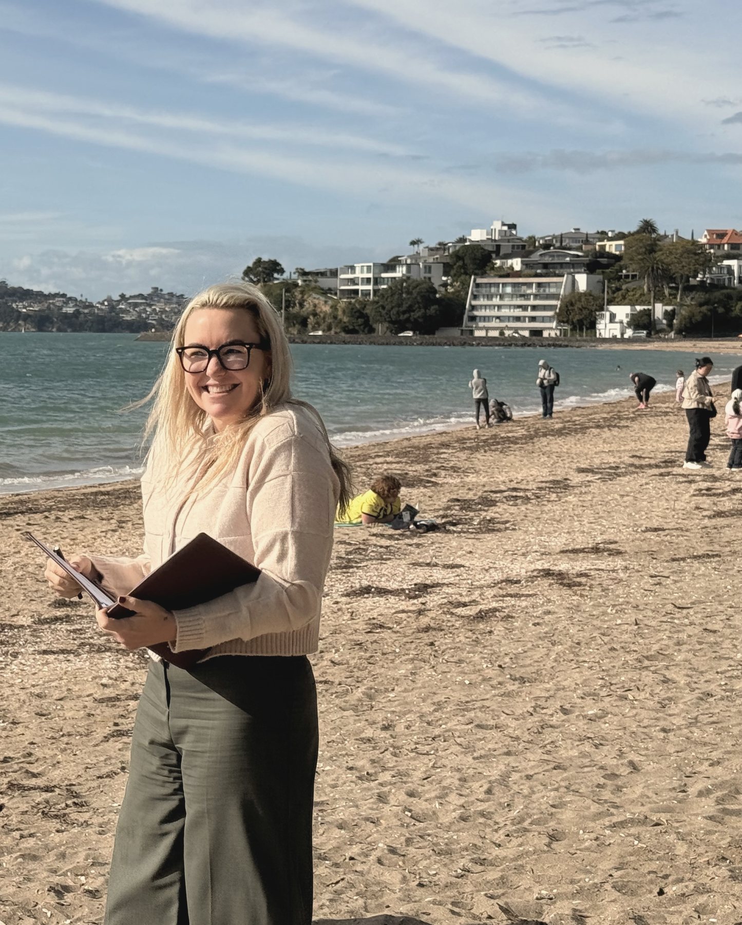 Lizzi at a beach ceremony with her folder