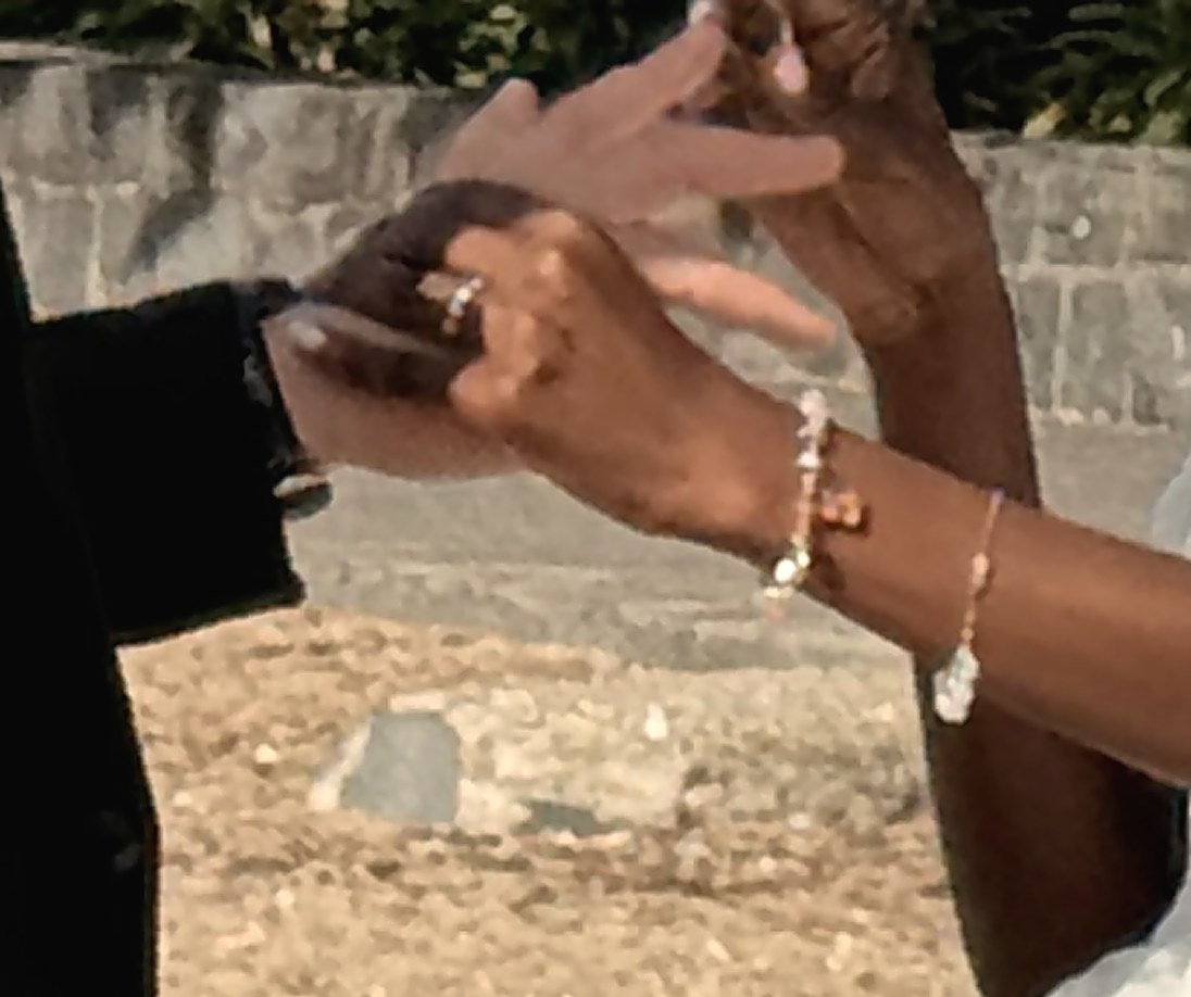 A ring being placed on a finger